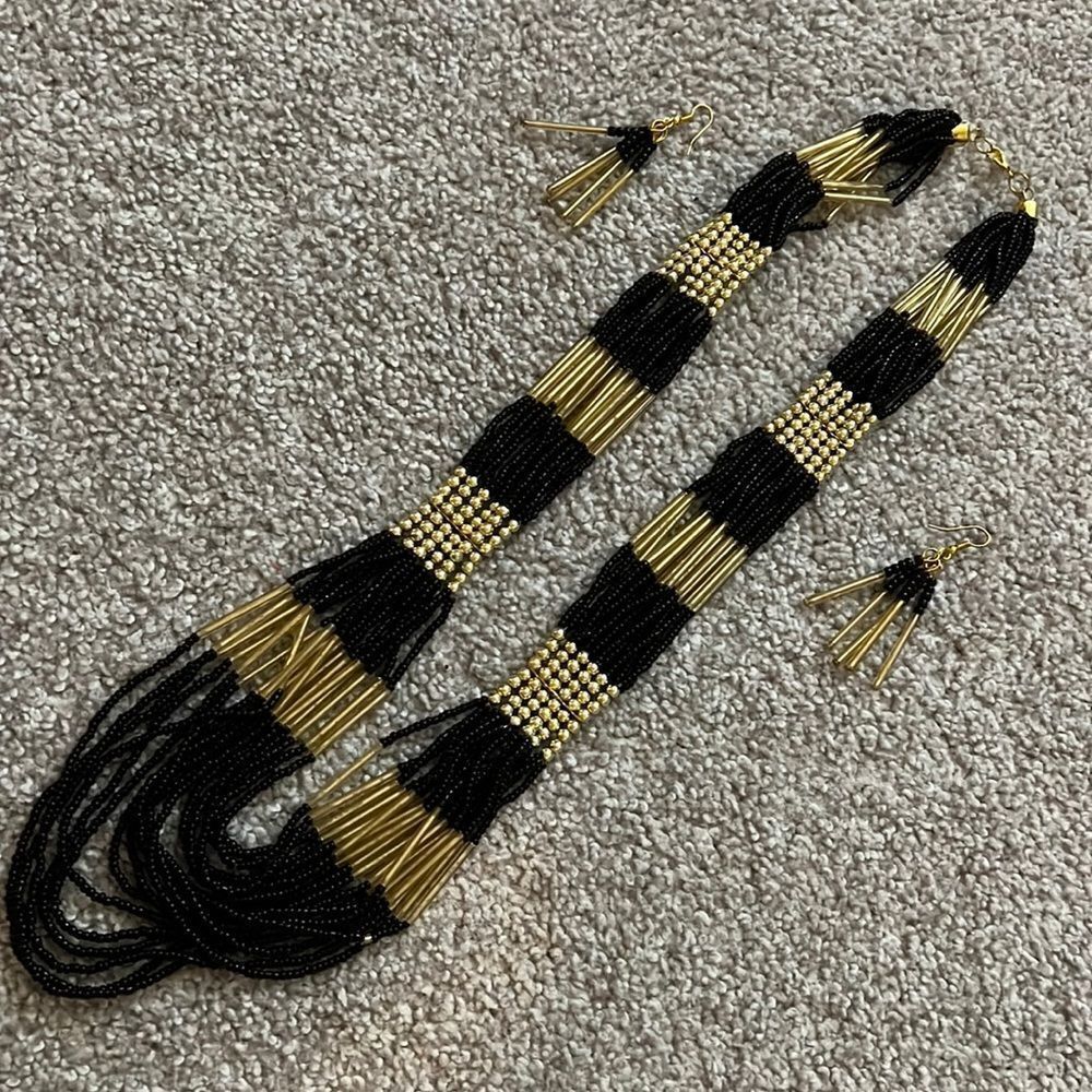 Black and gold multi strand statement necklace with earrings